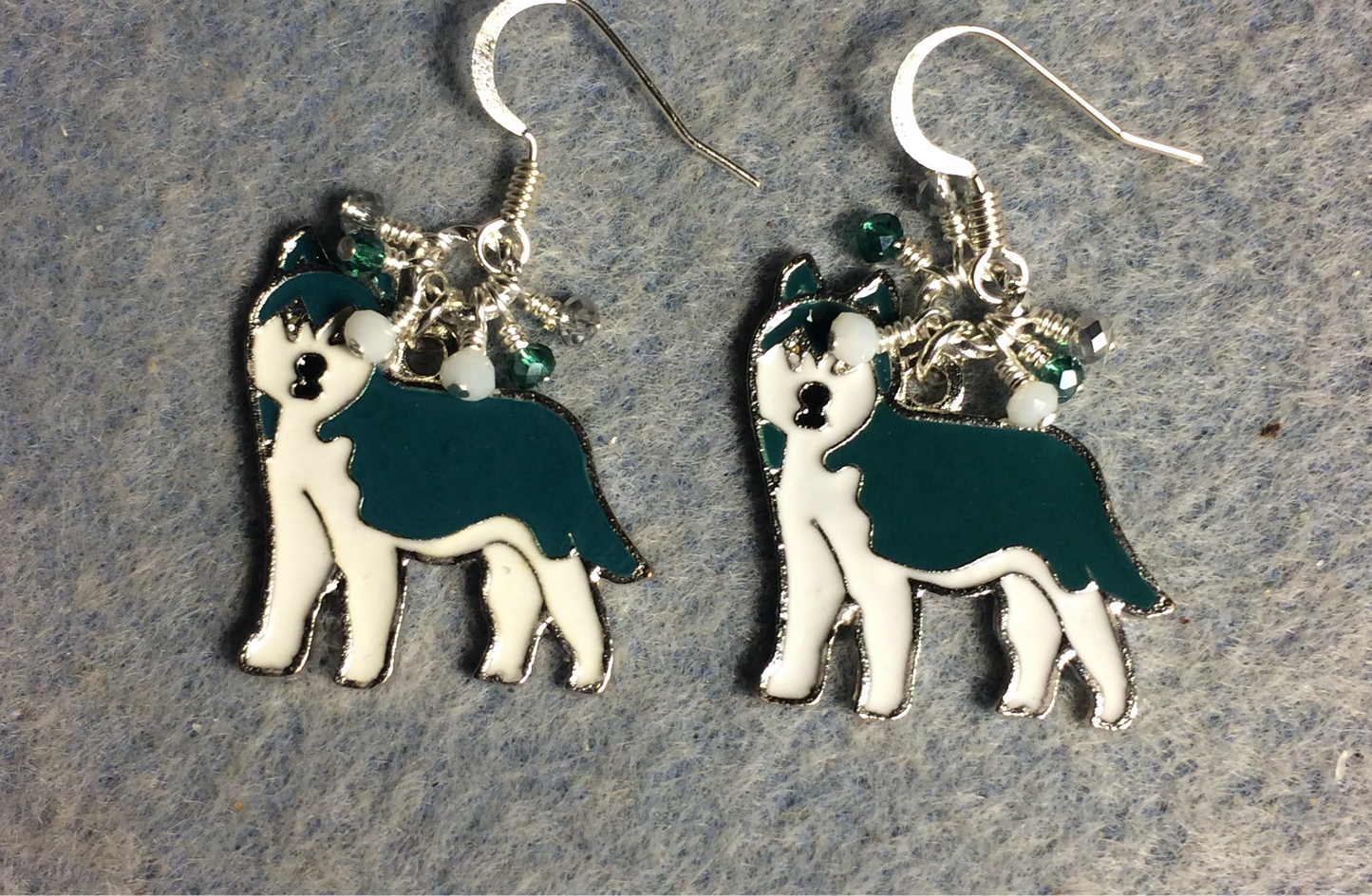 Teal and white enamel Siberian Husky charm earrings adorned with tiny dangling teal, white, and silver Chinese crystal beads.