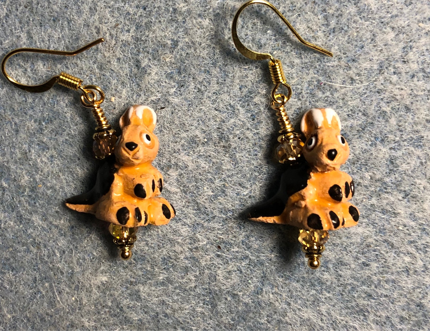 Small amber and black ceramic kangaroo bead earrings adorned with amber Chinese crystal beads.
