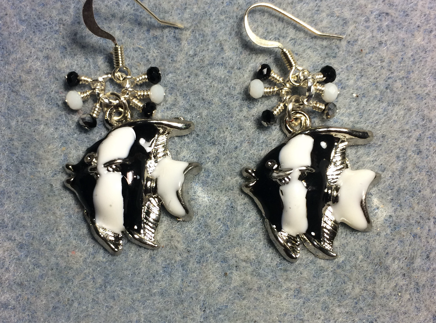 Black and white enamel striped angelfish charm earrings adorned with tiny dangling black and white Chinese crystal beads.