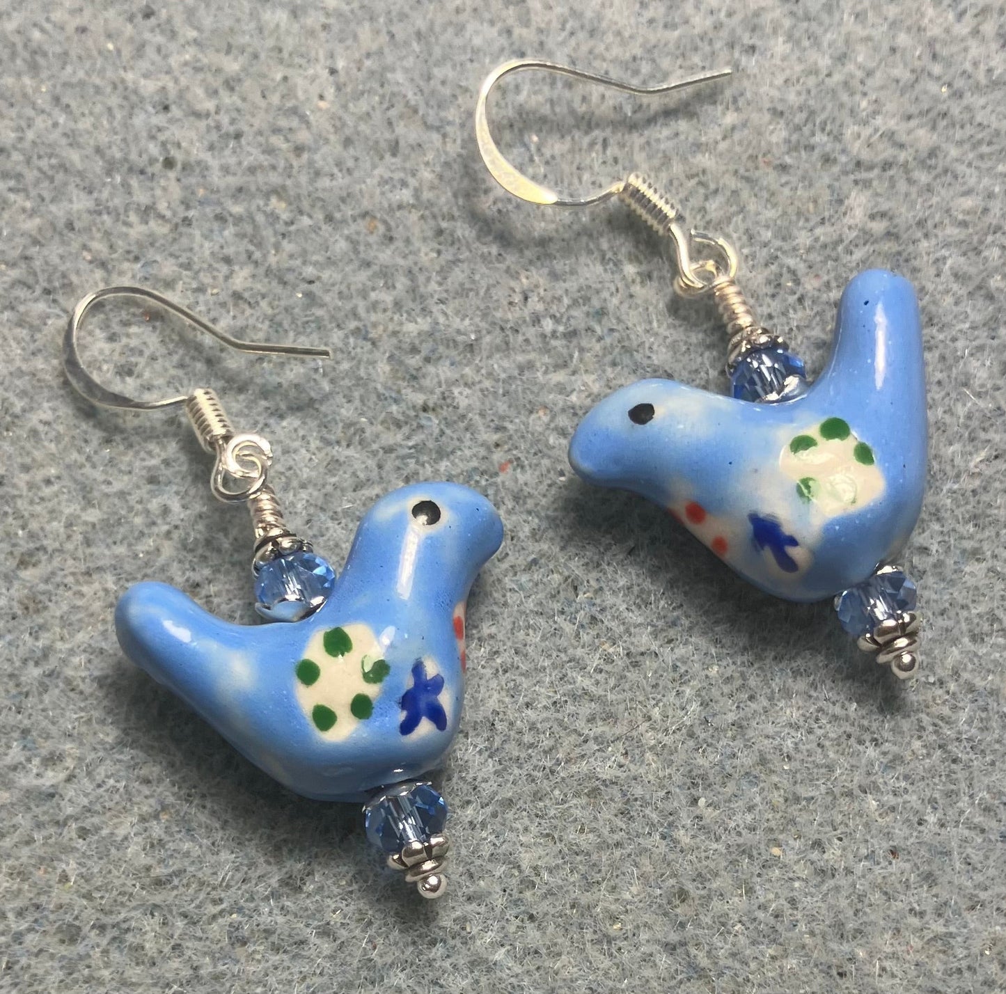 Small light blue, yellow, and green ceramic bird bead earrings adorned with light blue Chinese crystal beads.