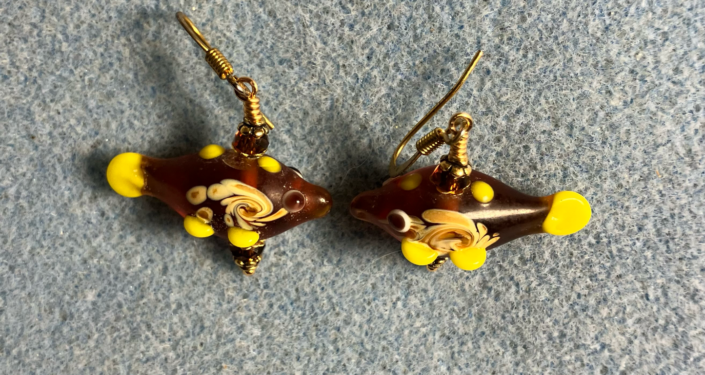 Amber lamp work fish bead earrings adorned with amber Chinese crystal beads.