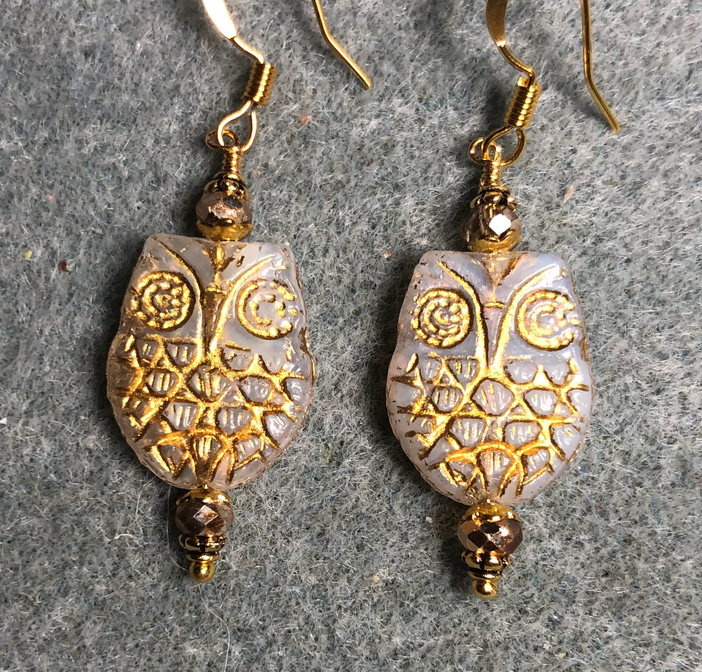 White (with gold wash) Czech glass owl bead earrings adorned with gold Chinese crystal beads.