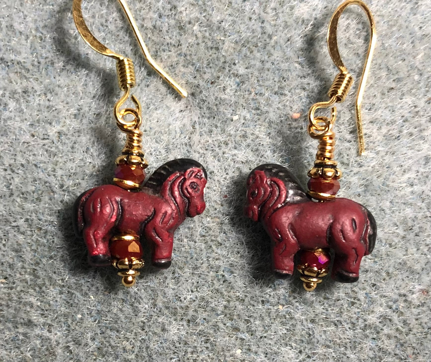 Small dark red ceramic horse bead earrings adorned with dark red Chinese crystal beads.