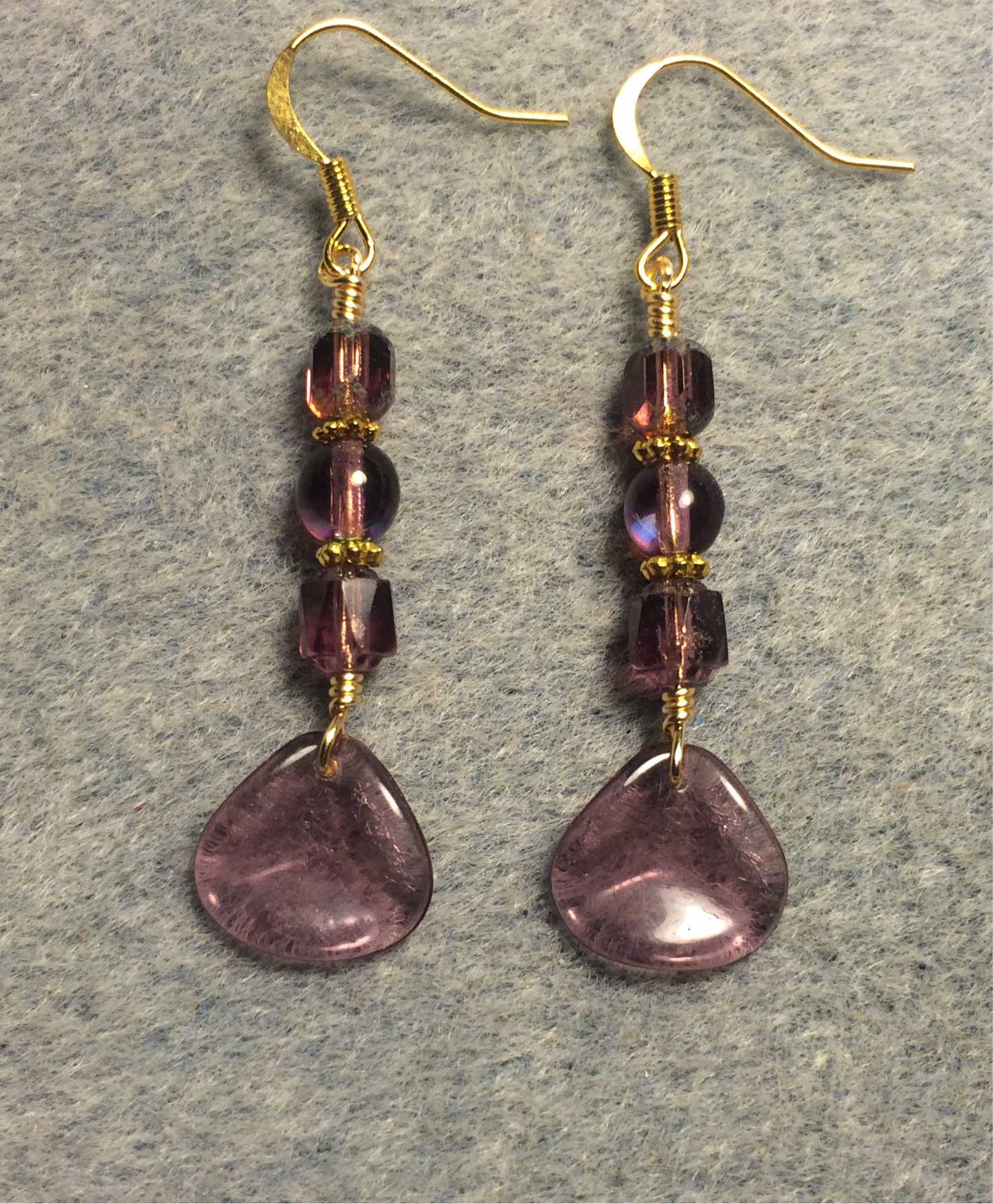 Translucent violet Czech glass rose petal earrings adorned with violet Czech glass beads.
