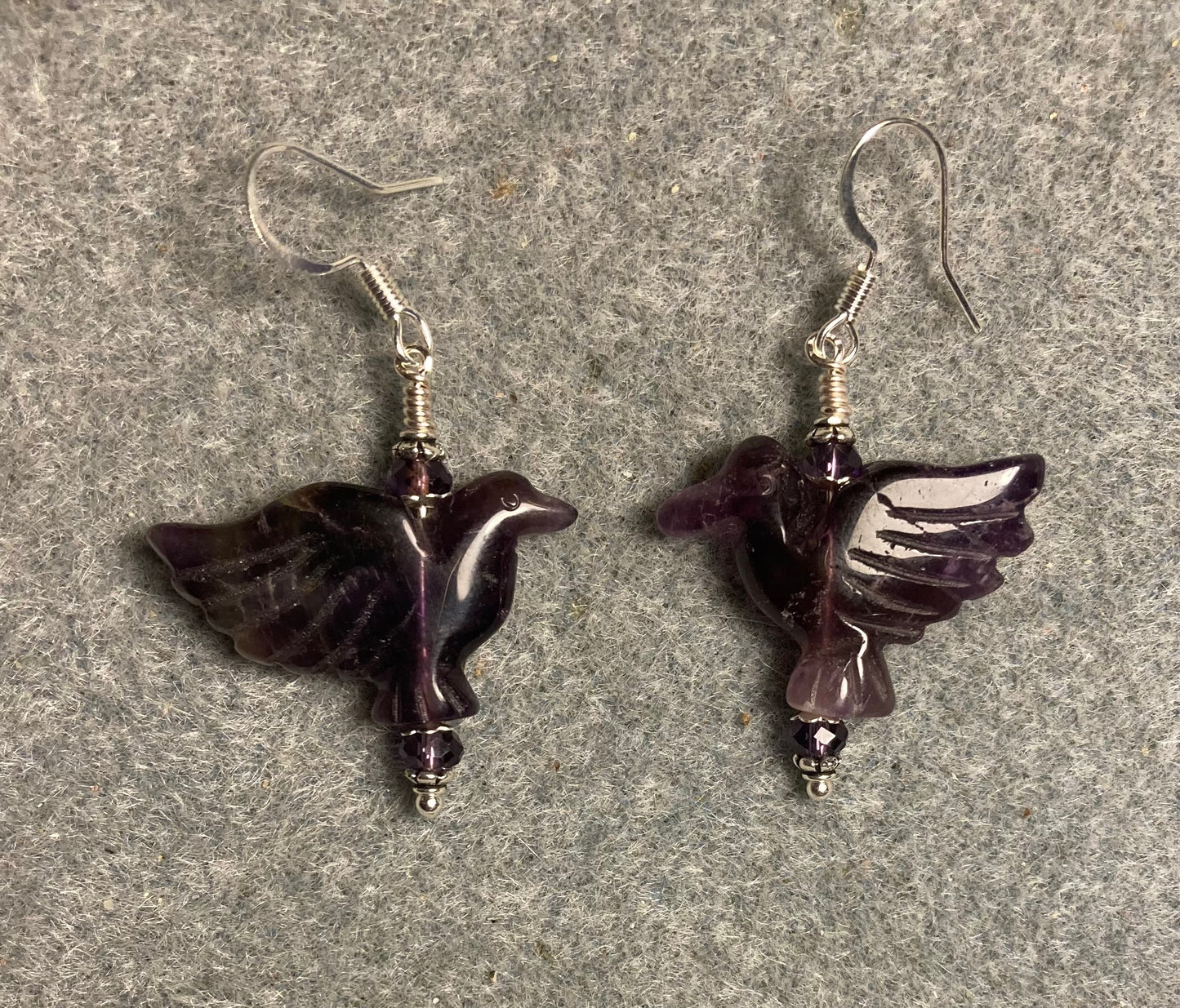 Amethyst gemstone flying eagle bead earrings adorned with purple Chinese crystal beads.