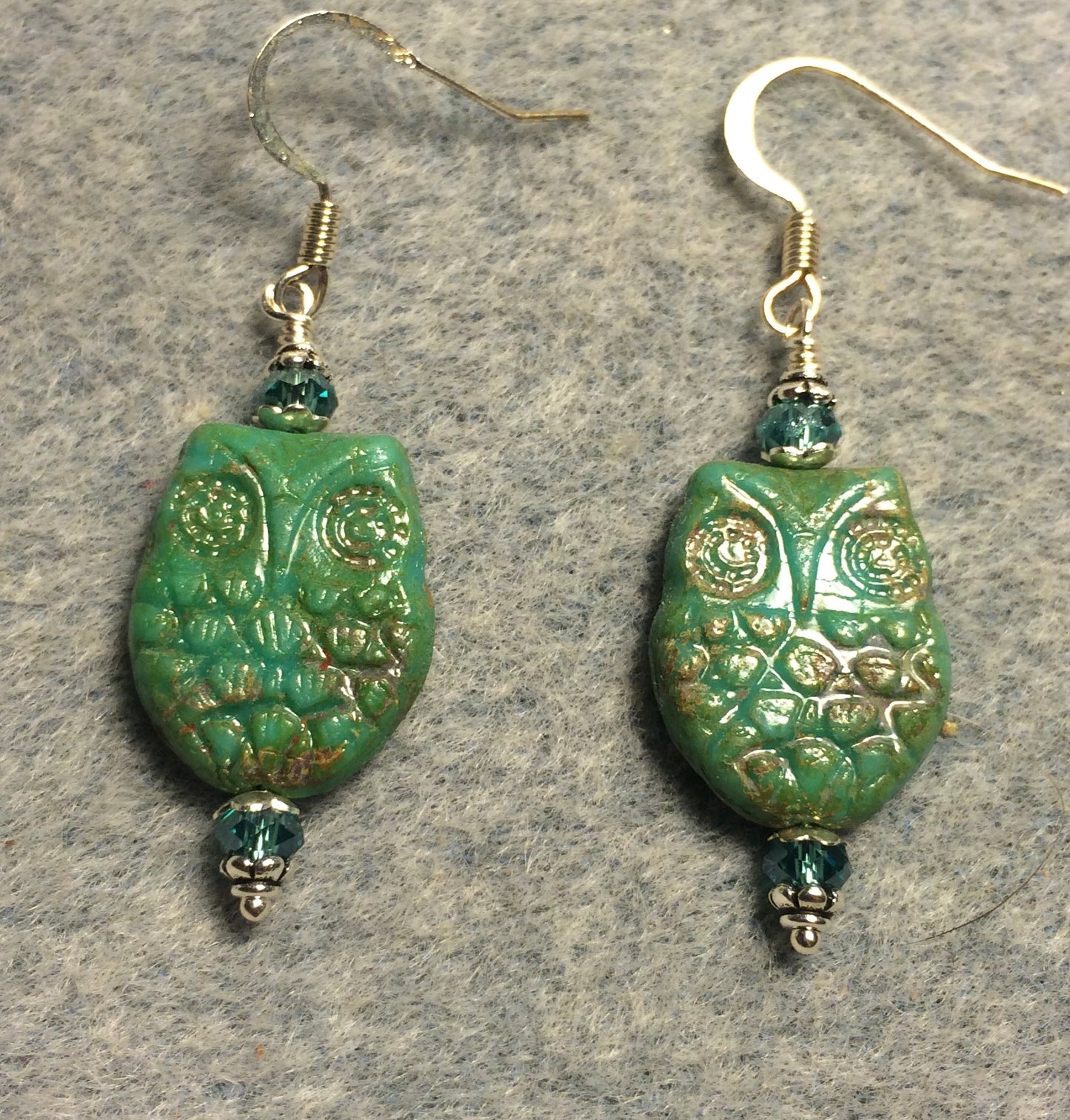 Green (with light Picasso wash) Czech glass owl bead earrings adorned with aqua green Chinese crystal beads.