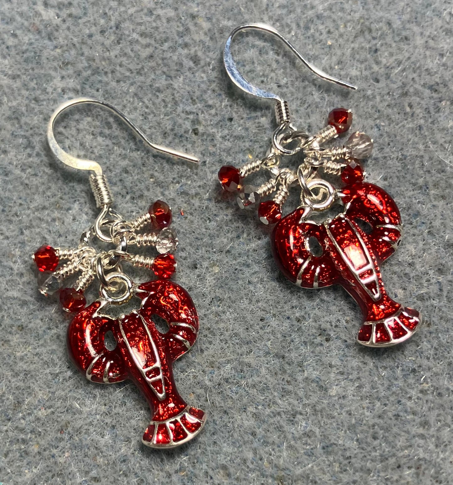 Silver and red enamel lobster charm earrings adorned with tiny dangling red and silver Chinese crystal beads.