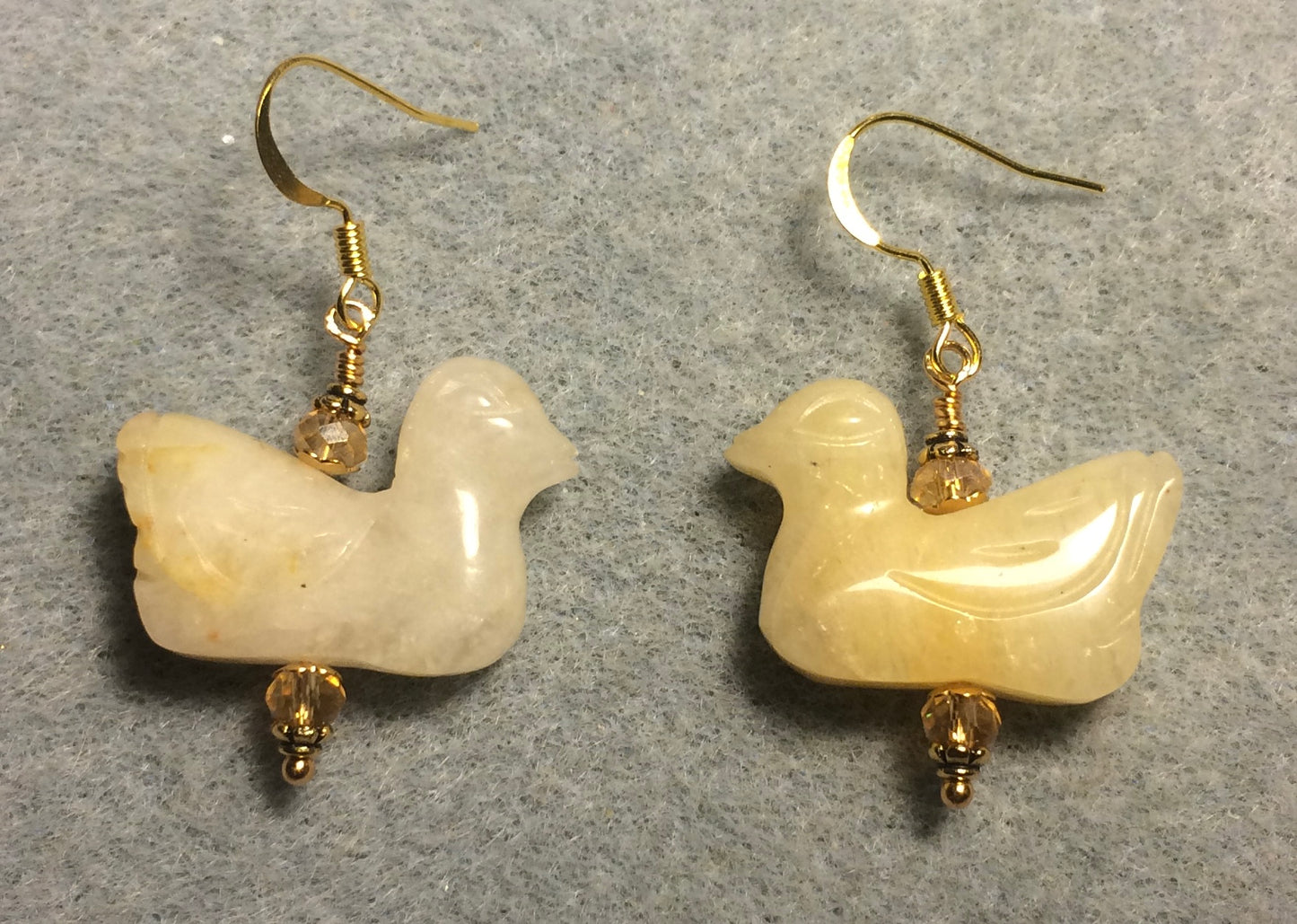 Yellow jadeite gemstone duck bead earrings adorned with topaz Chinese crystal beads.