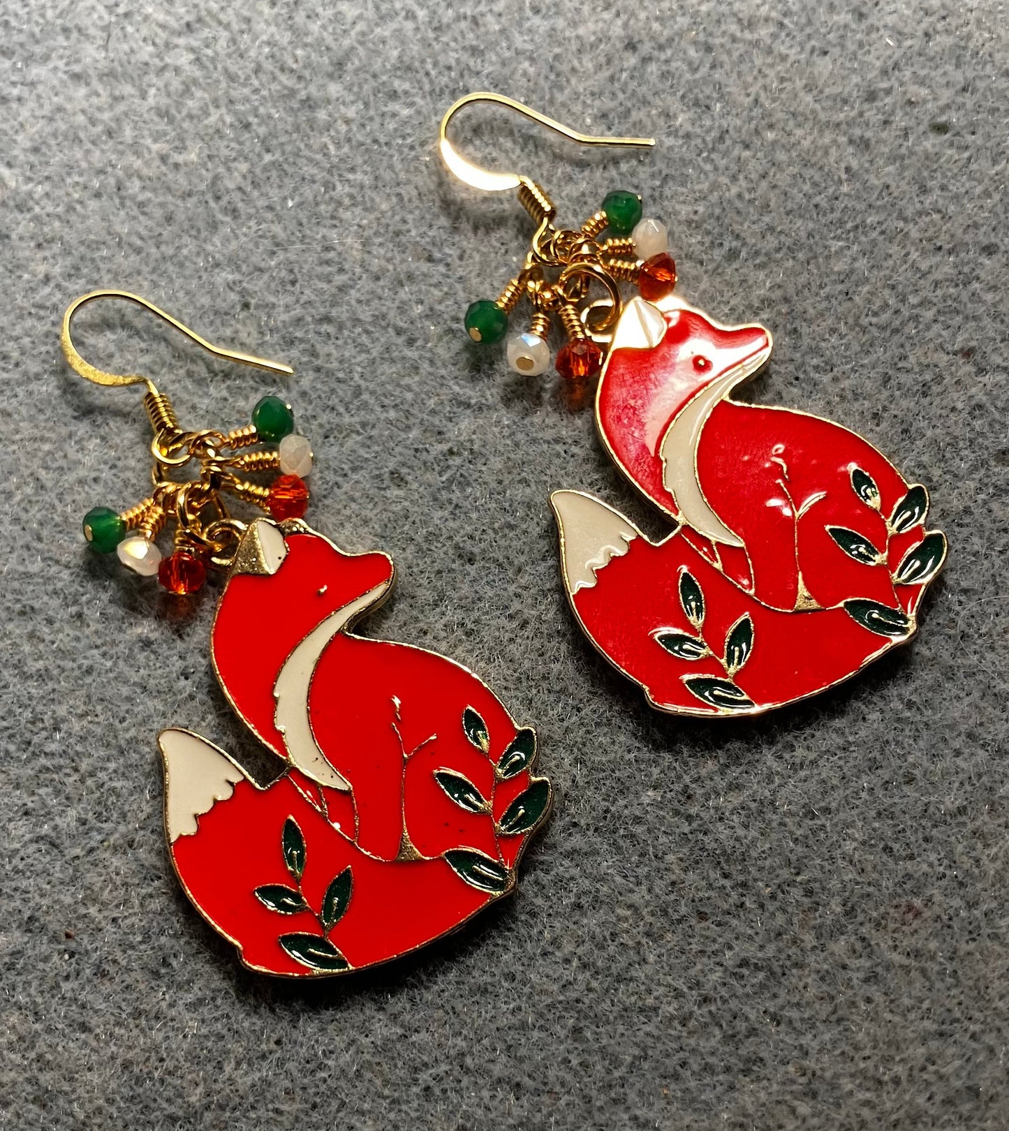 Red, white, and green enamel fox charm earrings adorned with tiny dangling red, white, and green Chinese crystal beads.