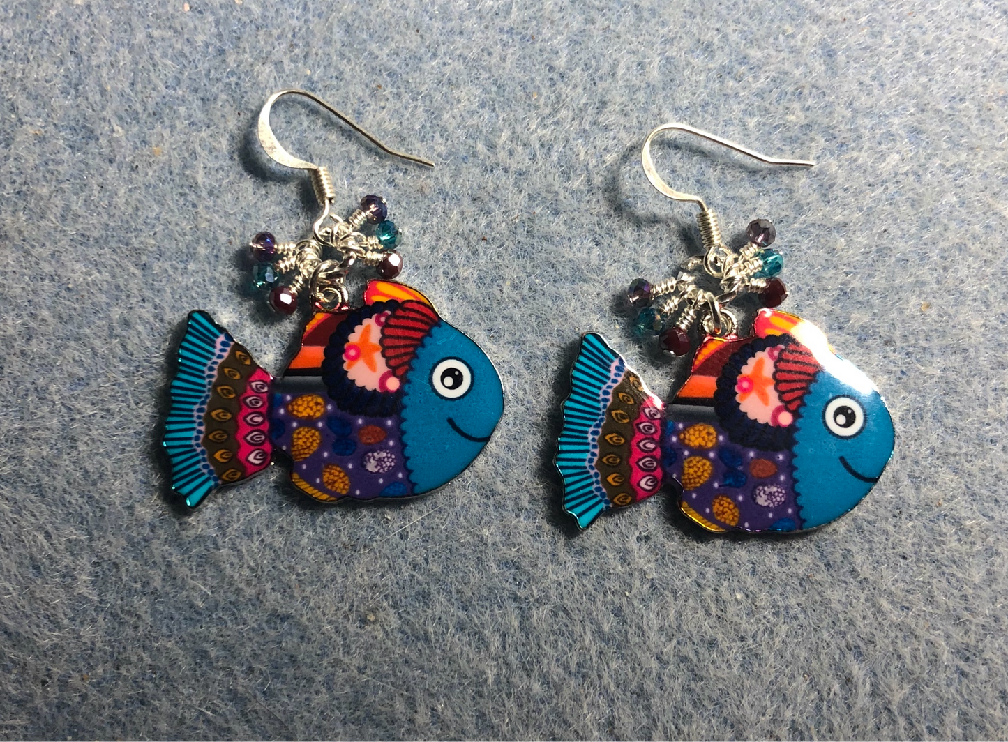 Turquoise, red, and purple enamel fish charm earrings adorned with tiny dangling turquoise, red, and purple Chinese crystal beads.