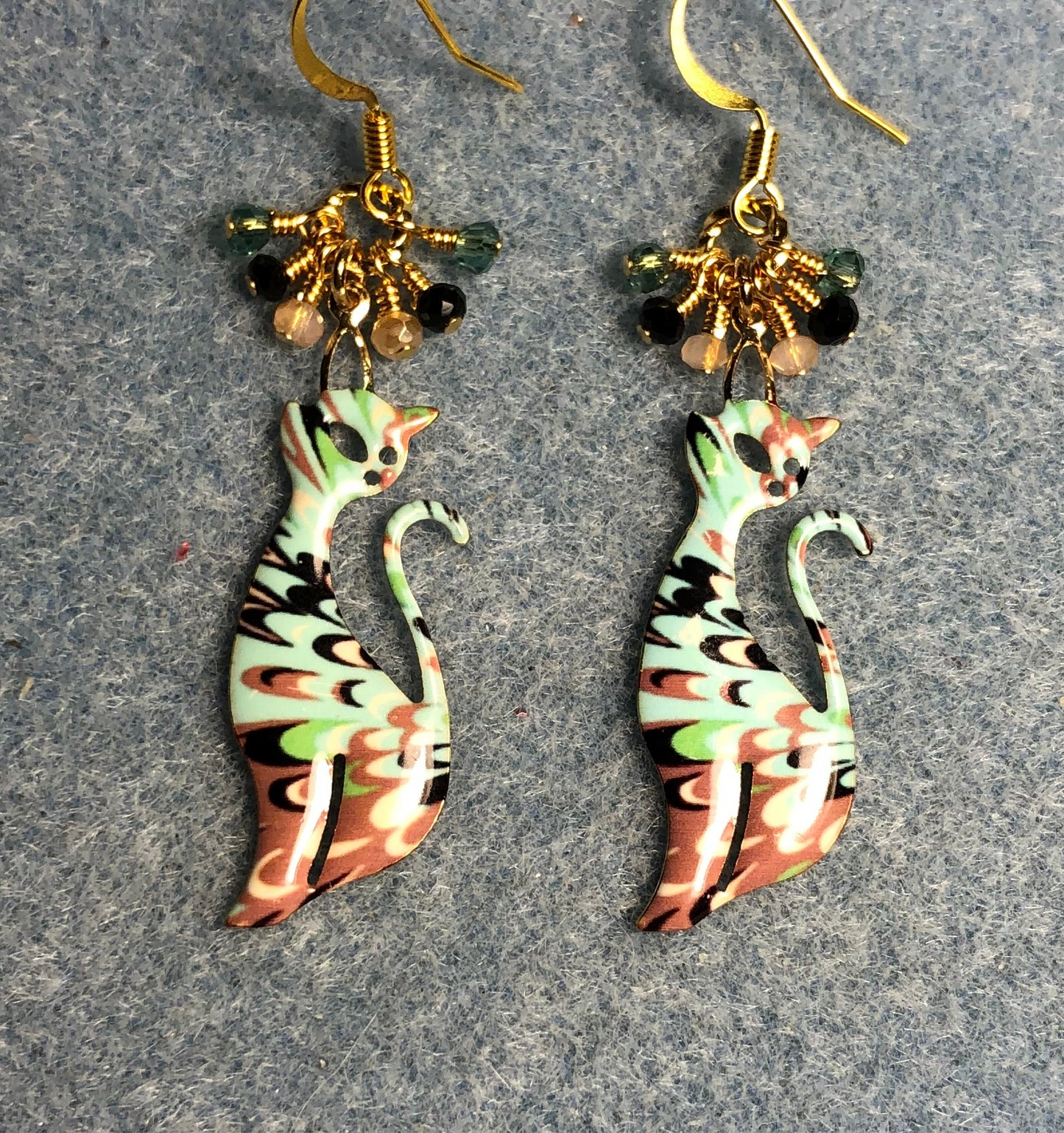 Turquoise, peach, and black enamel cat charm earrings adorned with tiny dangling turquoise, peach, and black Chinese crystal beads.