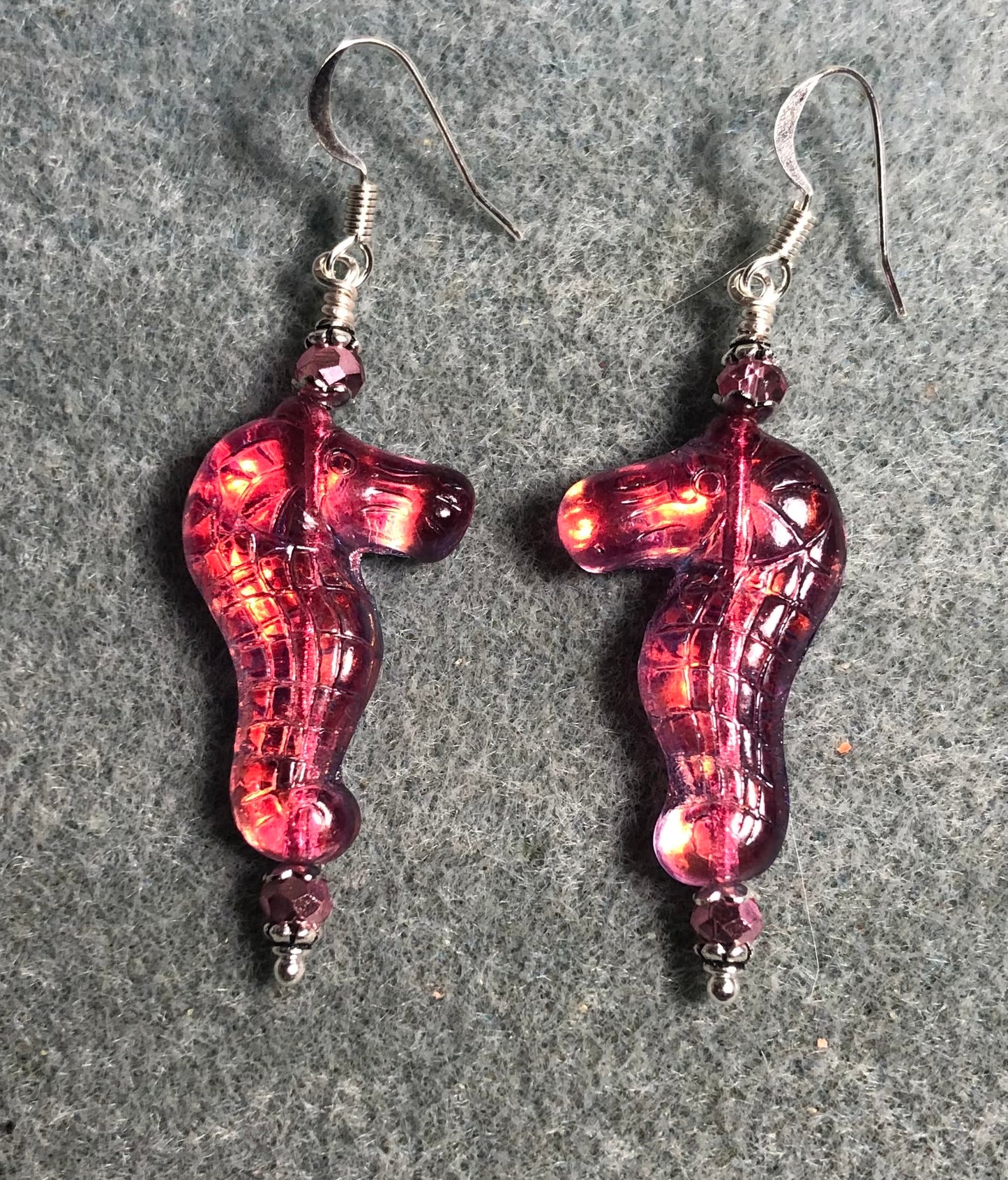 Shimmery hot pink Czech glass seahorse bead earrings adorned with hot pink Chinese crystal beads.