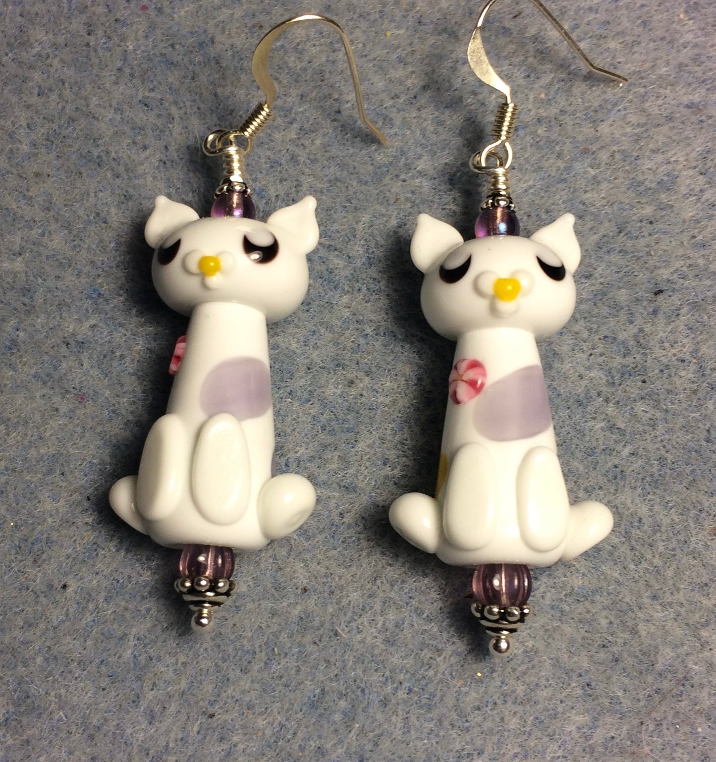 White and lavender lamp work cat bead earrings adorned with lavender Czech glass beads.