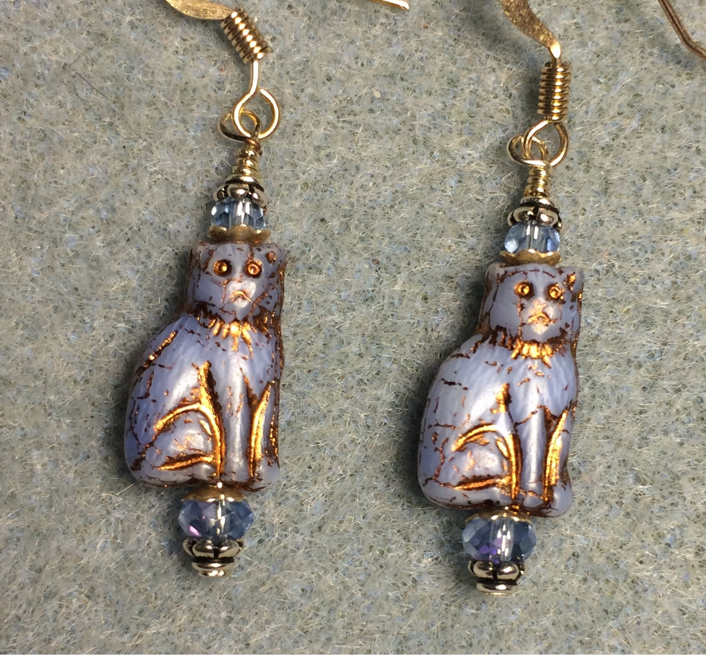 Small opaque light blue  (with copper inlay) Czech glass cat bead earrings adorned with light blue Chinese crystal beads.
