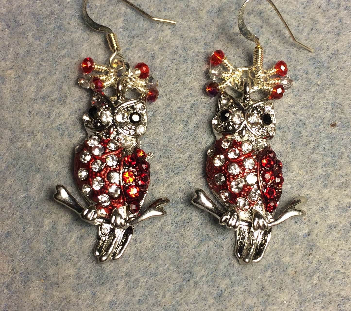 Silver and red rhinestone owl charm earrings adorned with tiny dangling red and silver Chinese crystal beads.