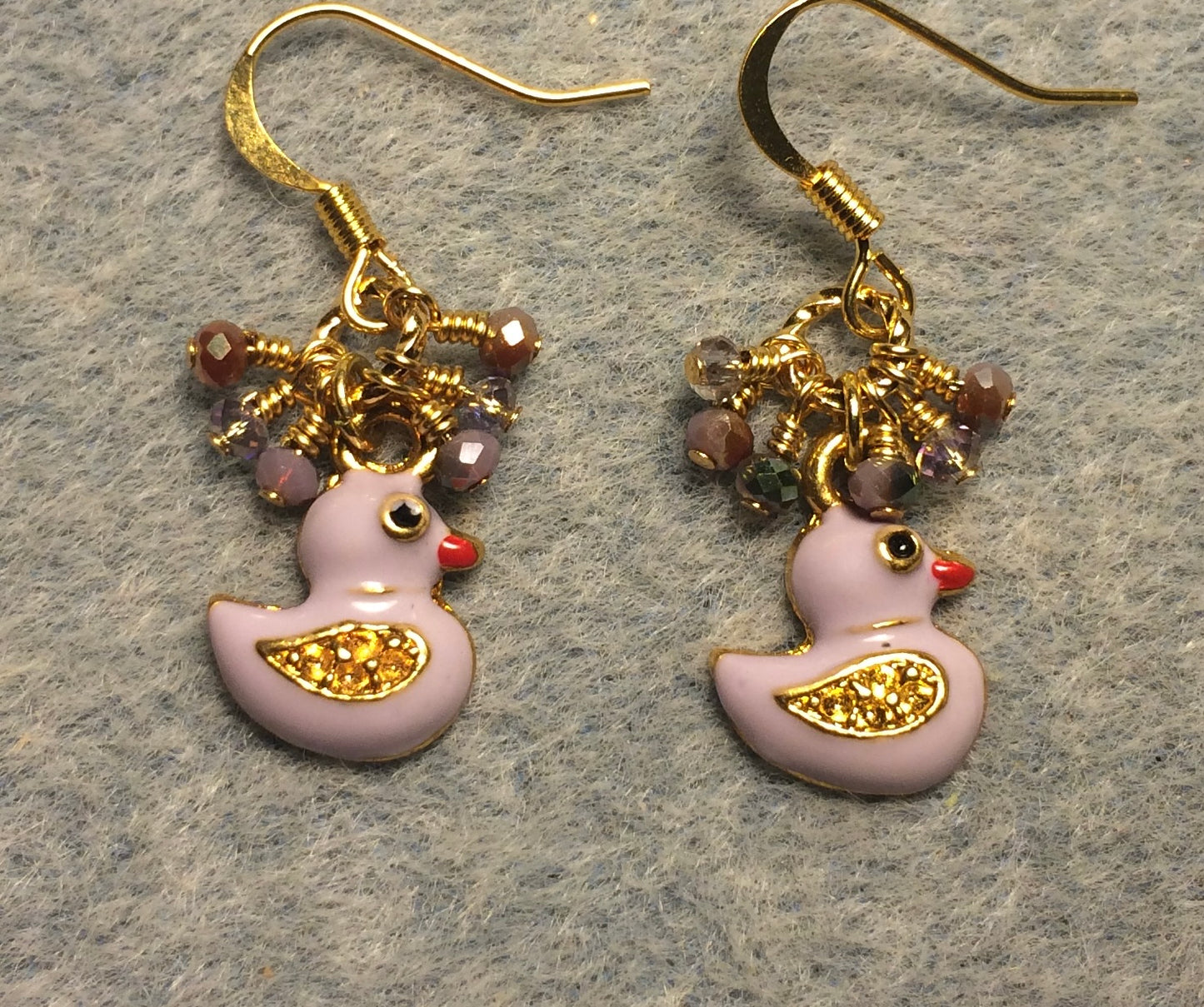 Small lavender enamel duck charm earrings adorned with tiny dangling lavender Chinese crystal beads.