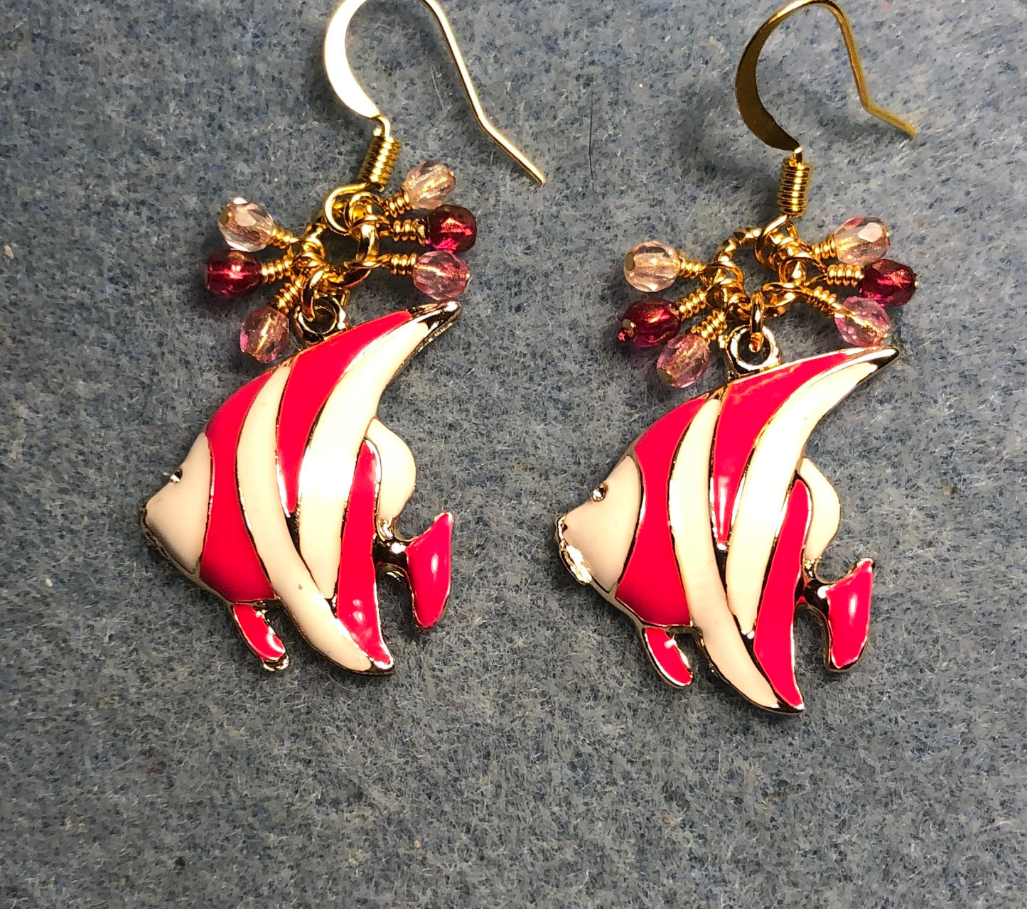 Hot pink and white enamel striped angelfish charm earrings adorned with small dangling hot pink and light pink Czech glass beads.