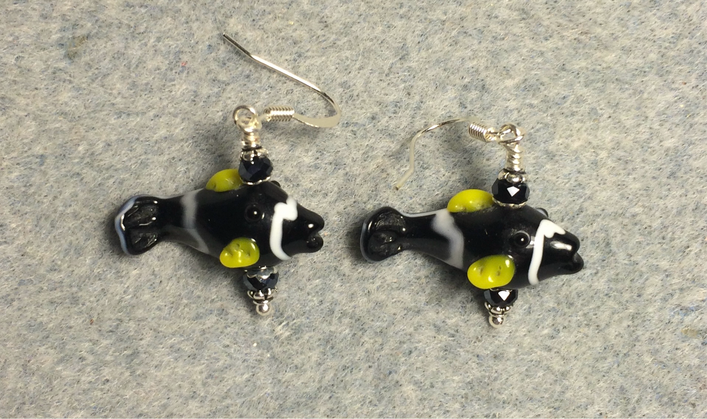 Small black and yellow lamp work fish bead earrings adorned with black Chinese crystal beads.