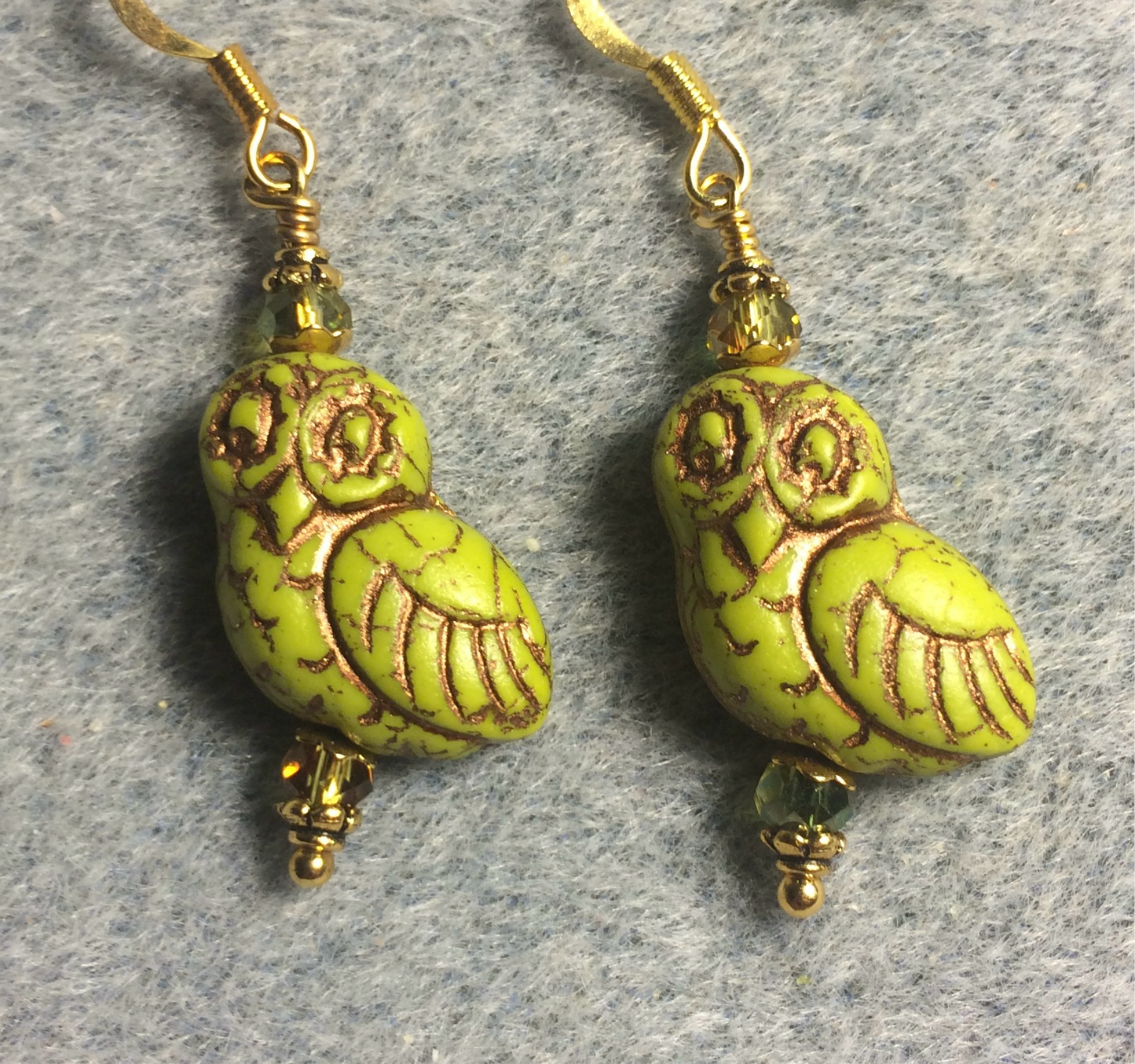 Lime green (with copper wash) fancy Czech glass owl bead earrings adorned with lime green Chinese crystal beads.