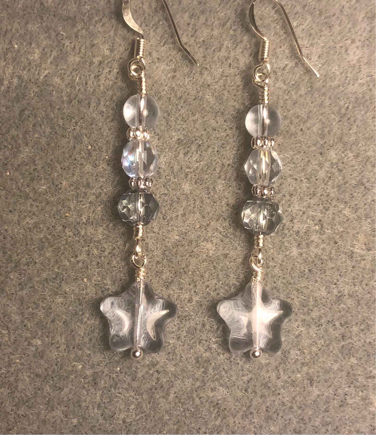 Small light blue Czech glass star bead earrings adorned with light blue Czech glass beads.