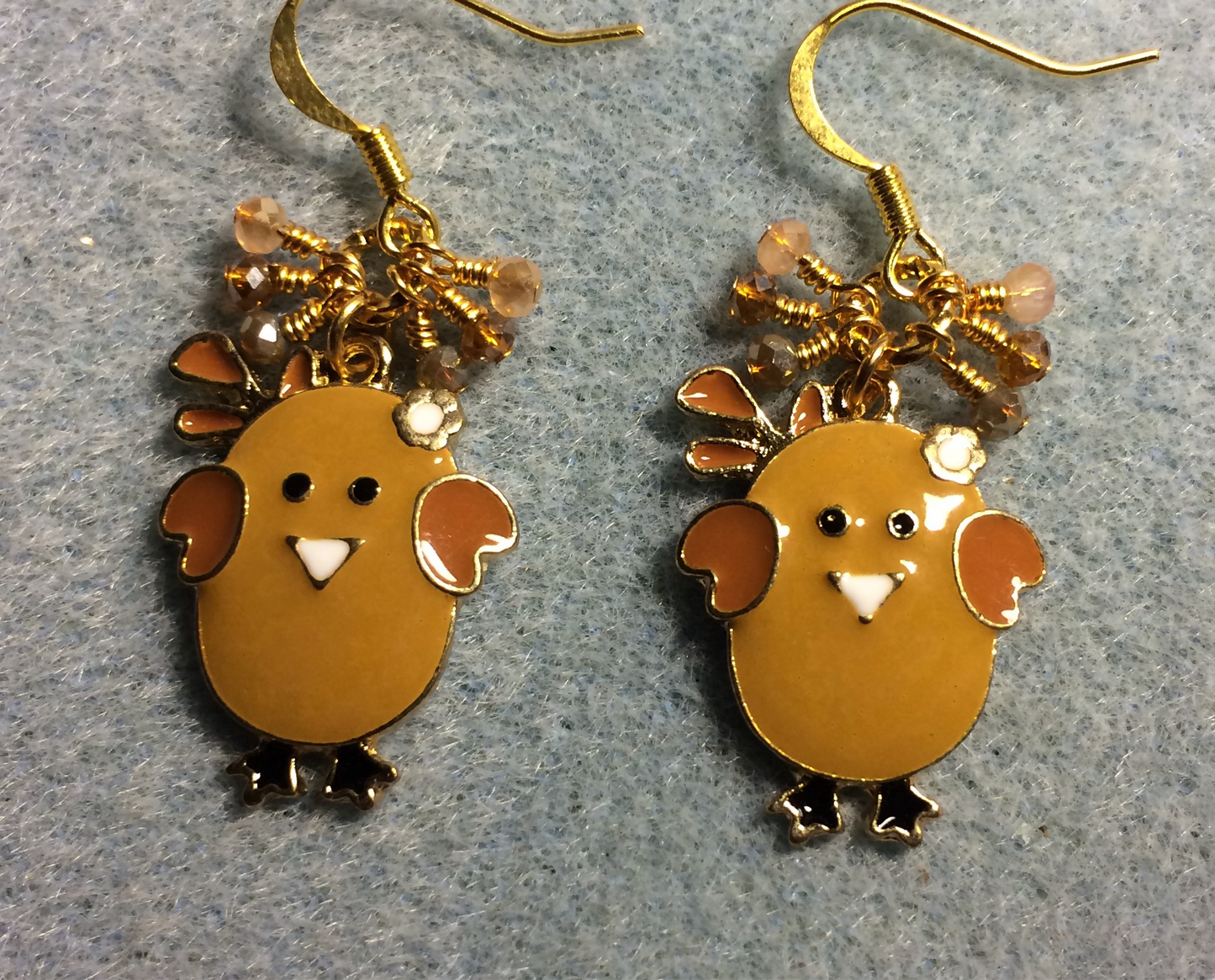 Brown and amber enamel chick charm earrings adorned with tiny dangling brown and amber Chinese crystal beads.