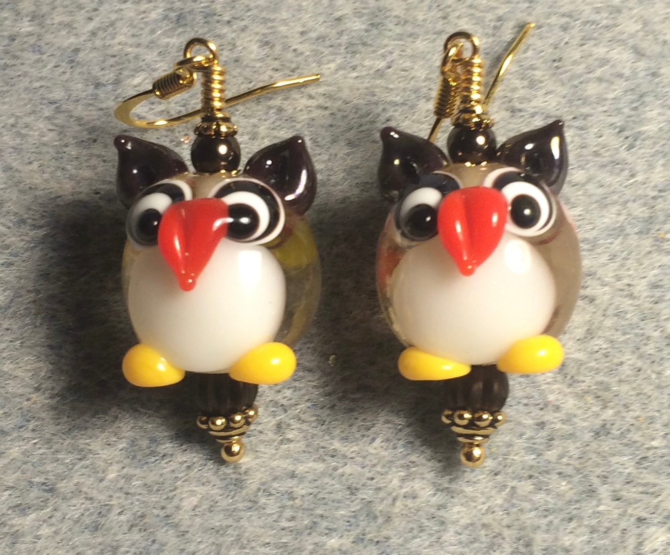 Brown and white lamp work owl bead earrings adorned with brown Czech glass beads.