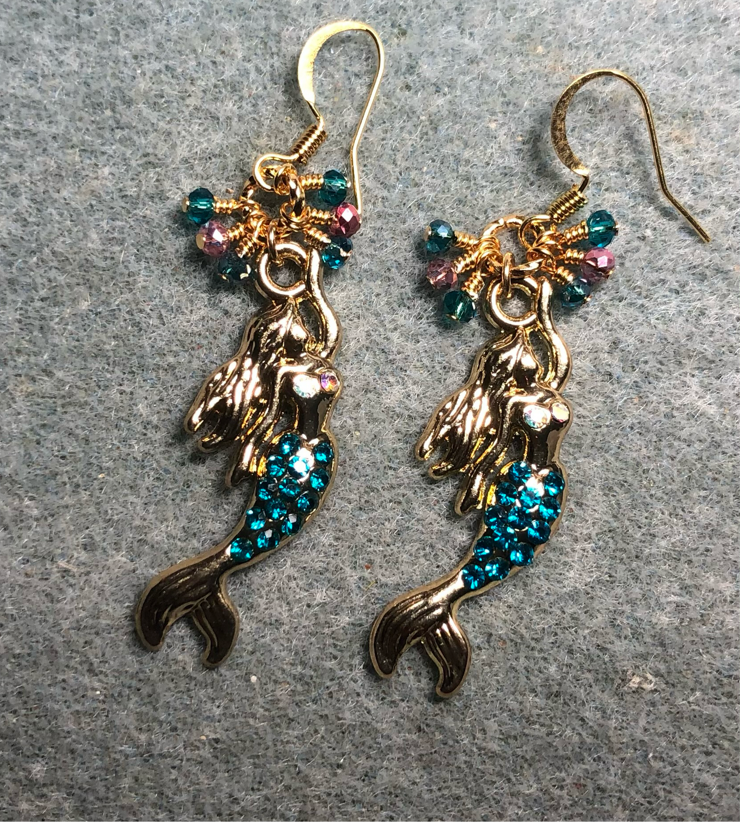 Gold and turquoise enamel and rhinestone mermaid charm earrings adorned with tiny dangling turquoise and pink Chinese crystal beads.
