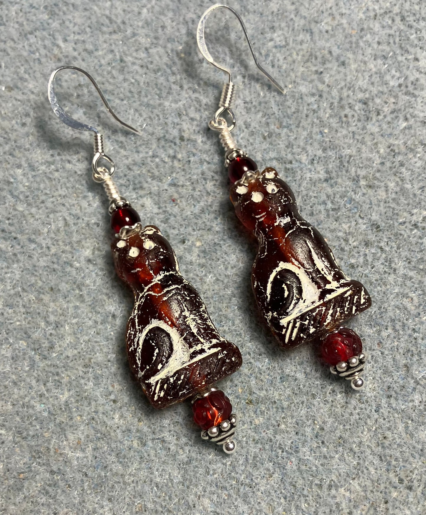 Dark red (with white inlay) fancy Czech glass cat bead earrings adorned with dark red Czech glass beads.