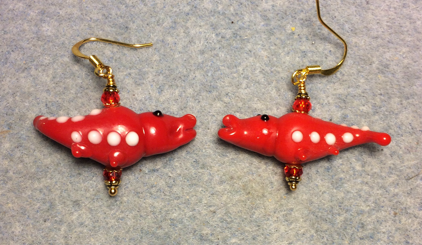Opaque red lamp work spotted alligator bead earrings adorned with red Chinese crystal beads.