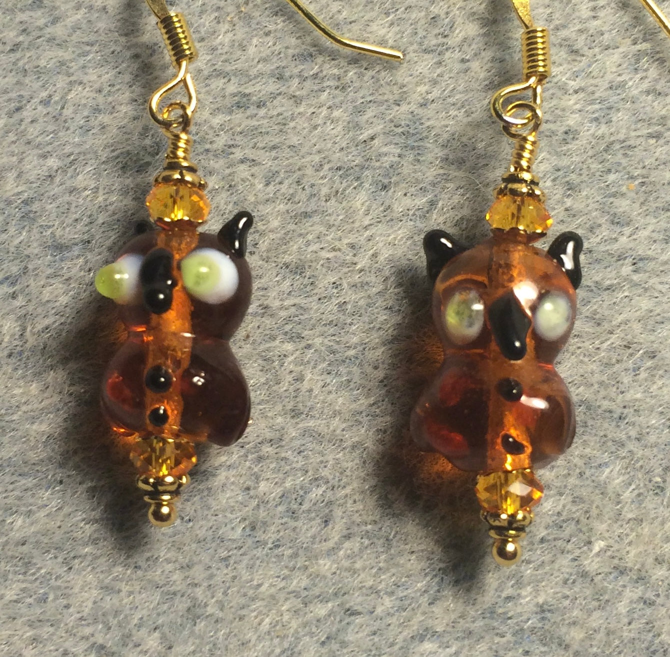 Small vintage amber lamp work owl bead earrings adorned with amber Chinese crystal beads.