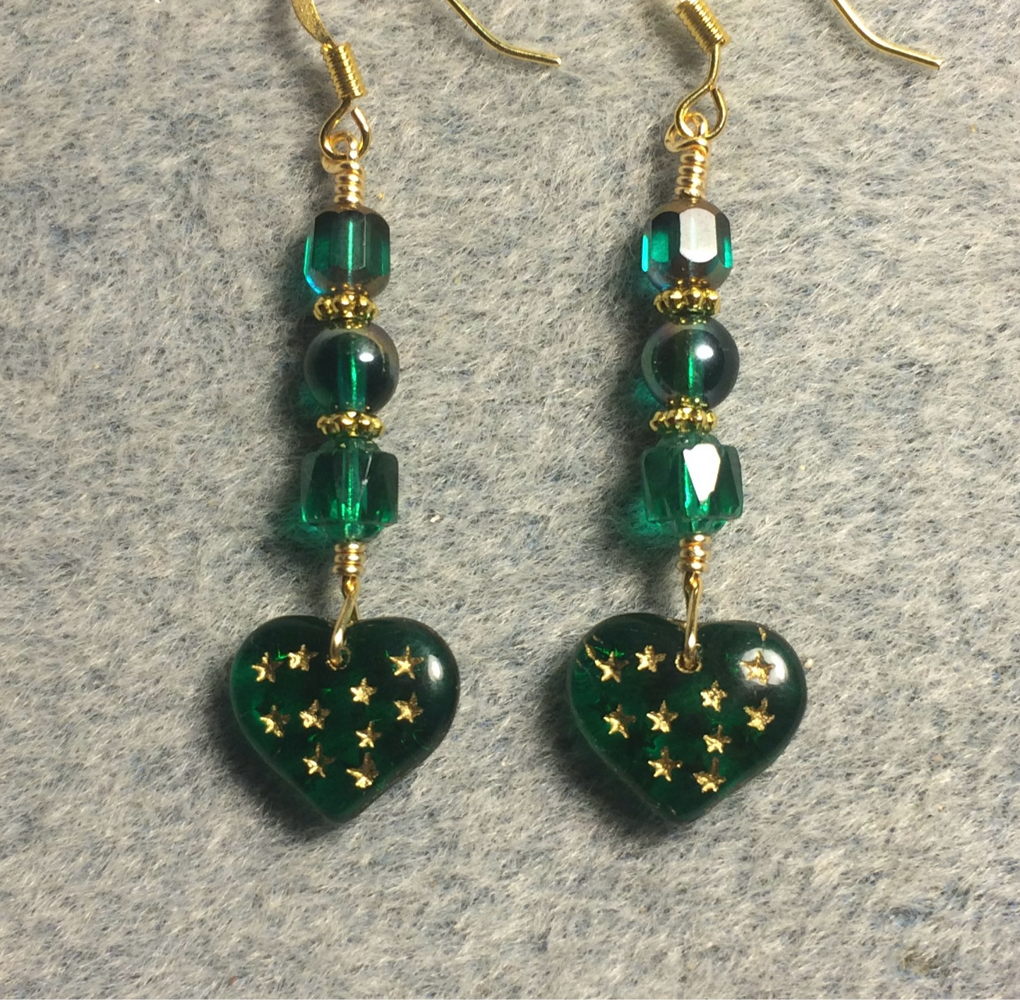 Teal green Czech glass heart bead earrings adorned with teal green Czech glass beads.