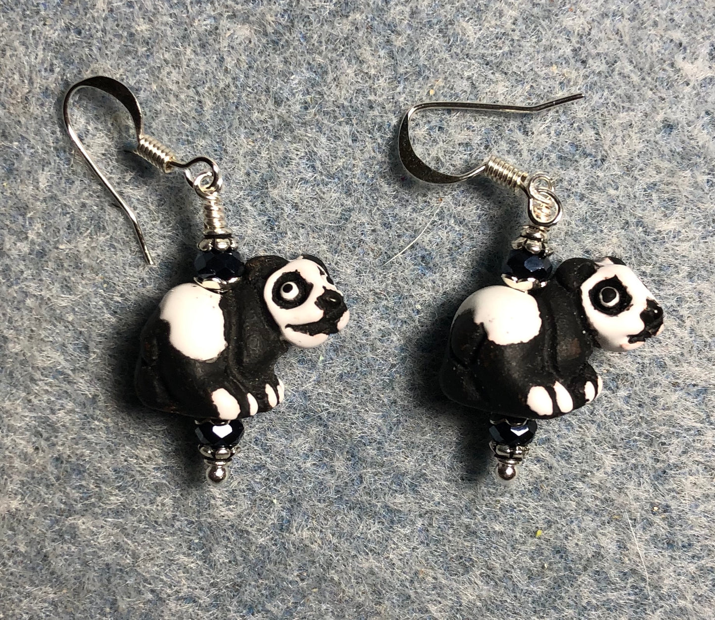 Small black and white ceramic panda bear bead earrings adorned with black Chinese crystal beads.