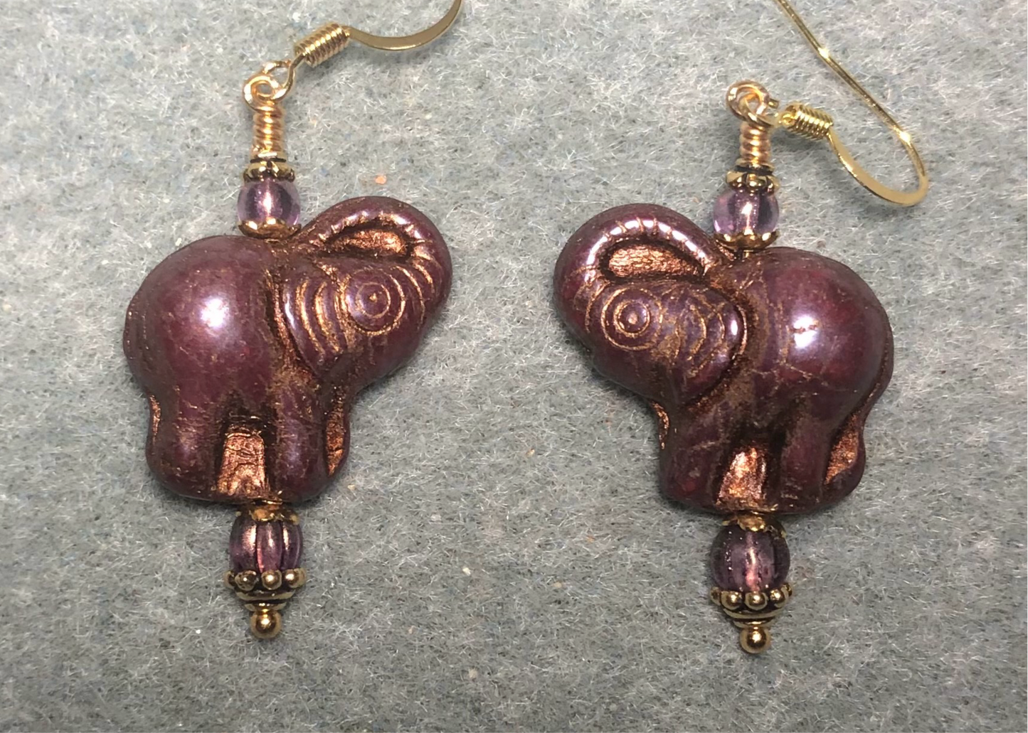 Purple (with copper inlay) Czech glass elephant bead earrings adorned with purple Czech glass beads.