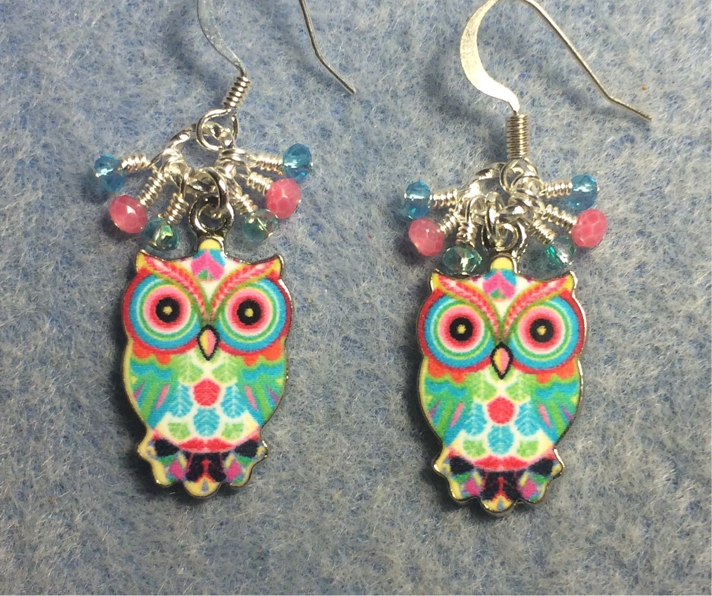 Aqua, pink, and turquoise enamel owl charm earrings adorned with tiny dangling aqua, pink, and turquoise Chinese crystal beads.