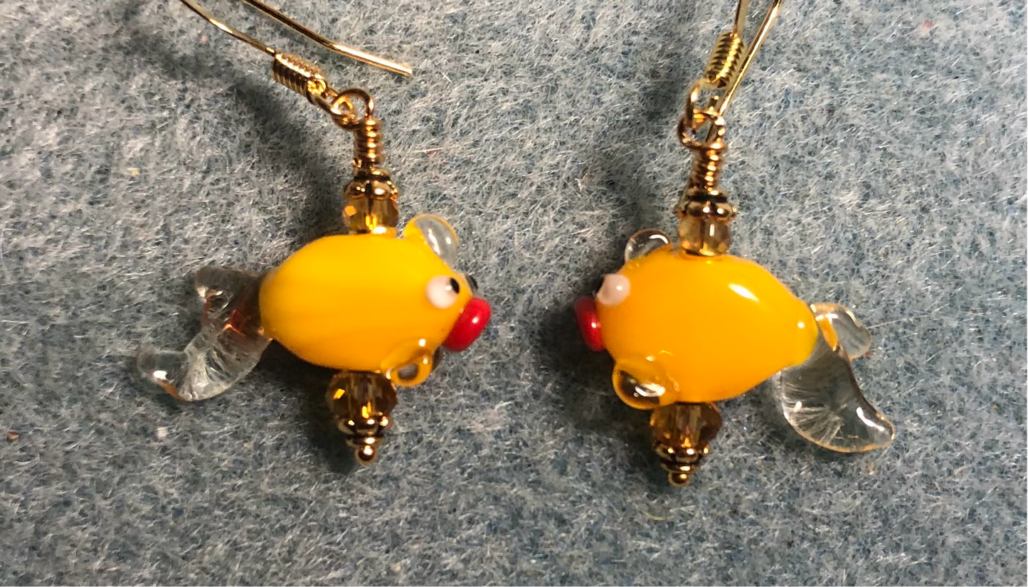 Small tangerine lamp work goldfish bead earrings adorned with tangerine Chinese crystal beads.