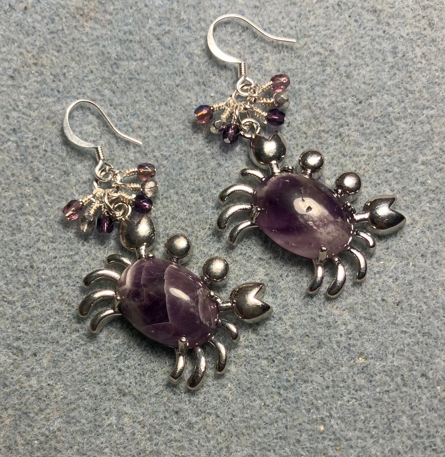 Silver and amethyst gemstone crab charm earrings adorned with small dangling purple and silver Czech glass beads.