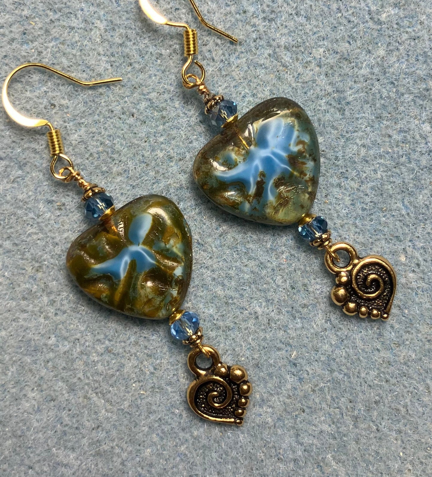 Blue Picasso Czech glass heart bead earrings made with light blue Chinese crystal beads and gold Tierracast spiral heart charms.