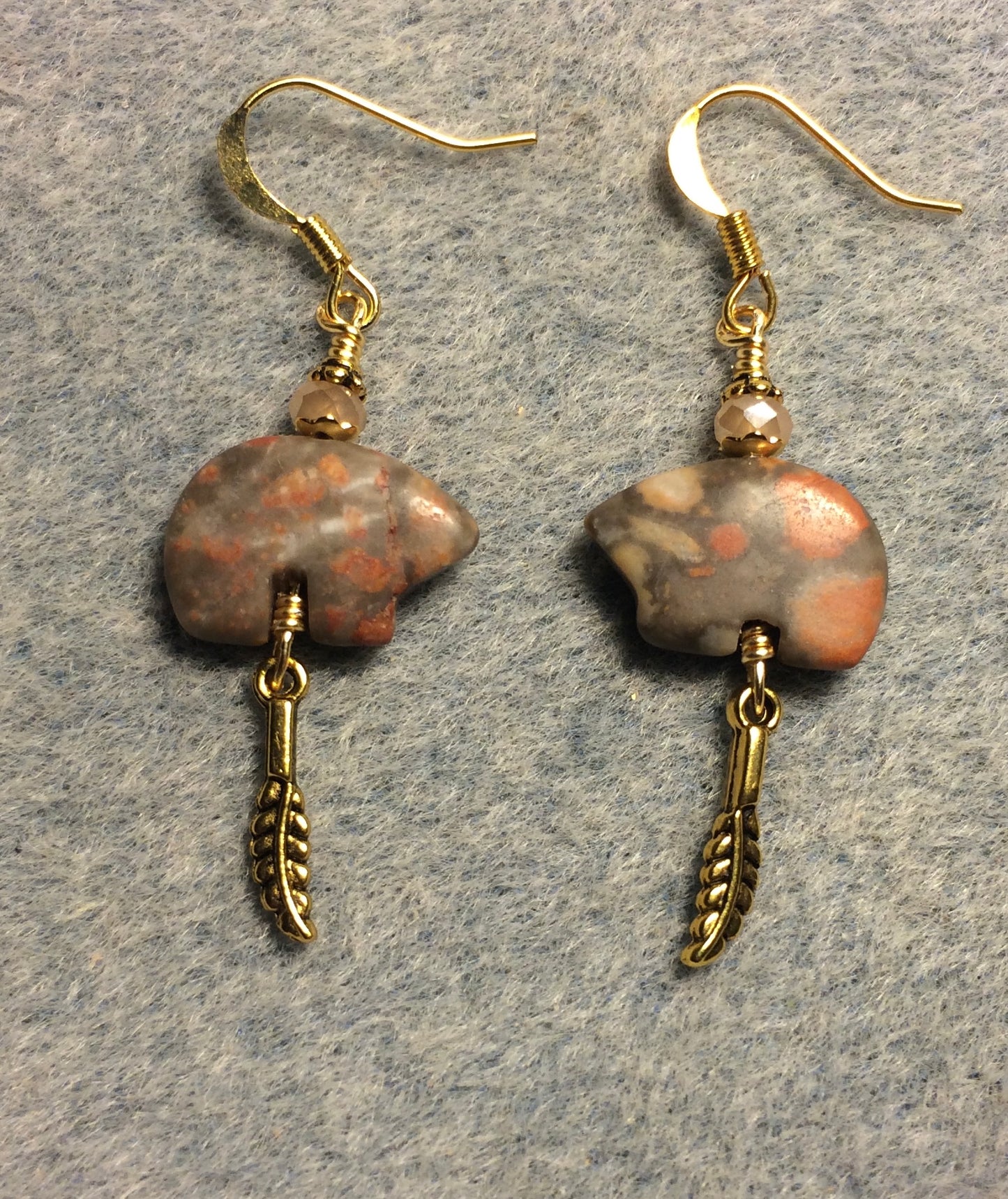 Peach oyster opal agate gemstone Zuni bear fetish bead earrings adorned with peach crystal beads and tiny gold feather charms.