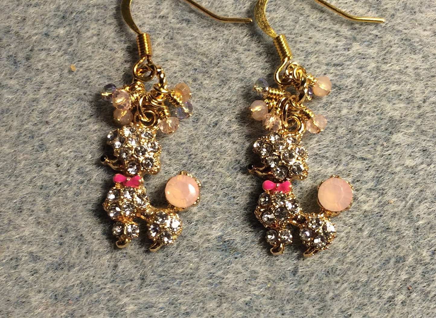 Peach, pink, and gold rhinestone poodle charm earrings adorned with tiny dangling peach and pink Chinese crystal beads.
