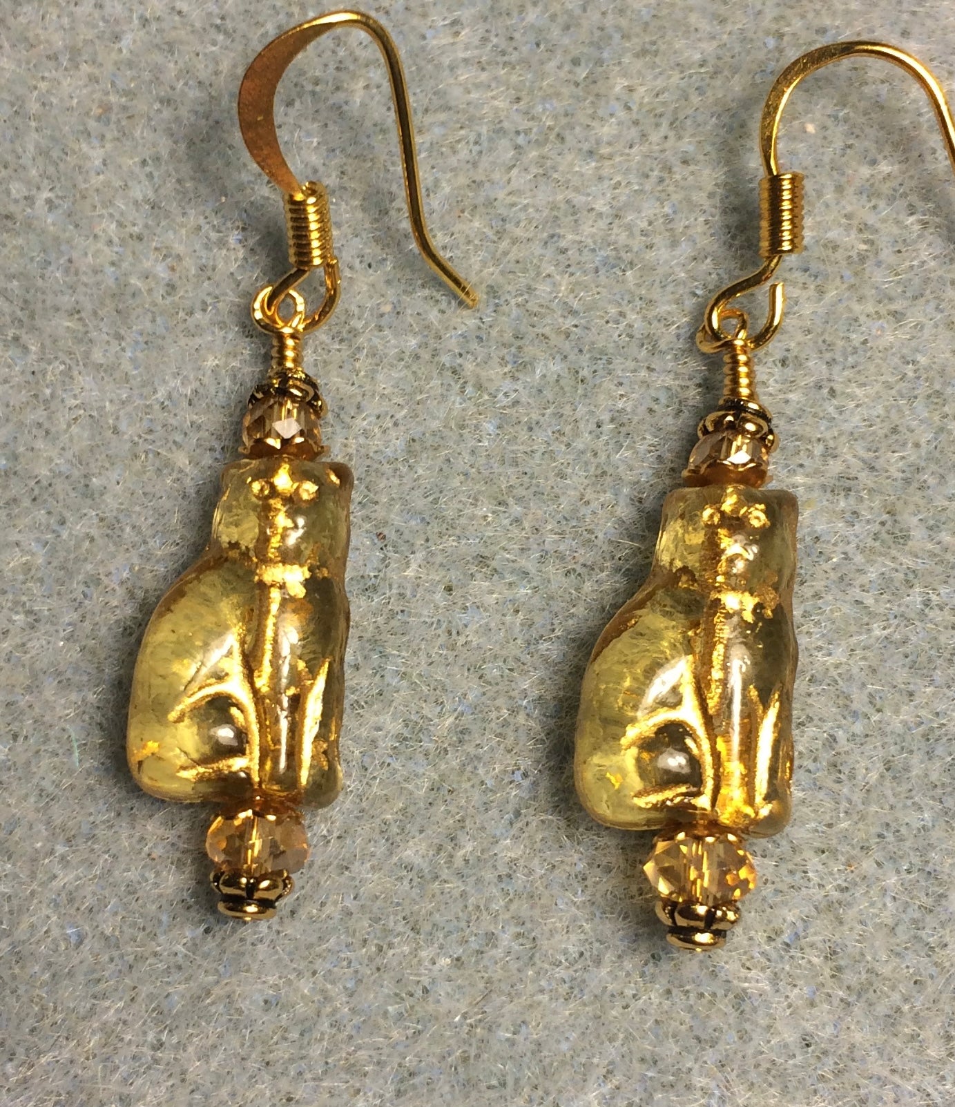 Small translucent amber (with gold inlay) Czech glass cat bead earrings adorned with amber Chinese crystal beads.