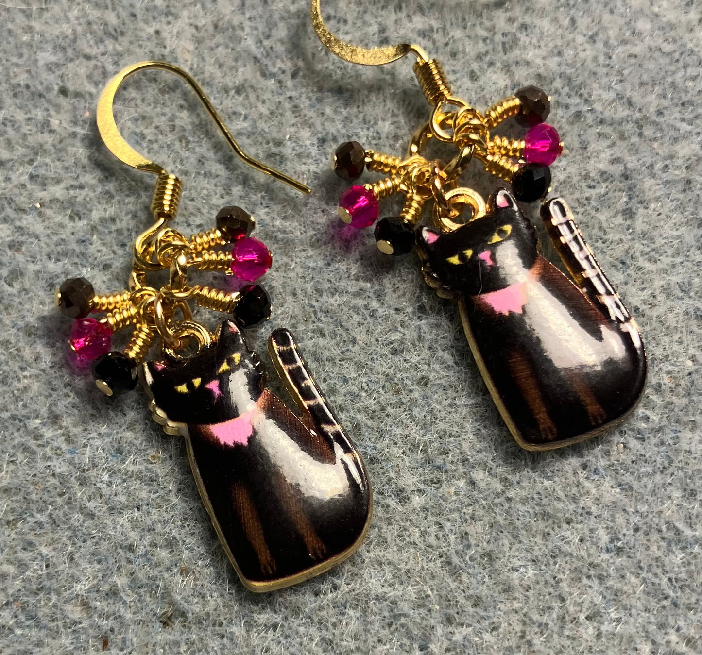 Black, brown, and pink enamel cat charm earrings adorned with tiny dangling black, brown, and pink Chinese crystal beads.