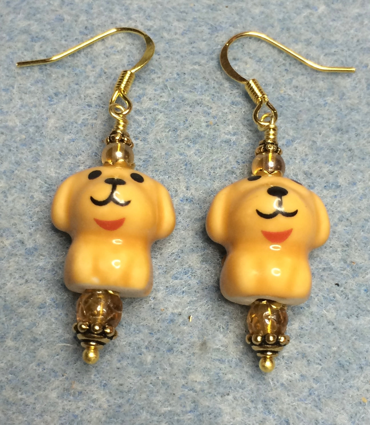 Amber ceramic puppy dog bead earrings adorned with amber Czech glass beads.