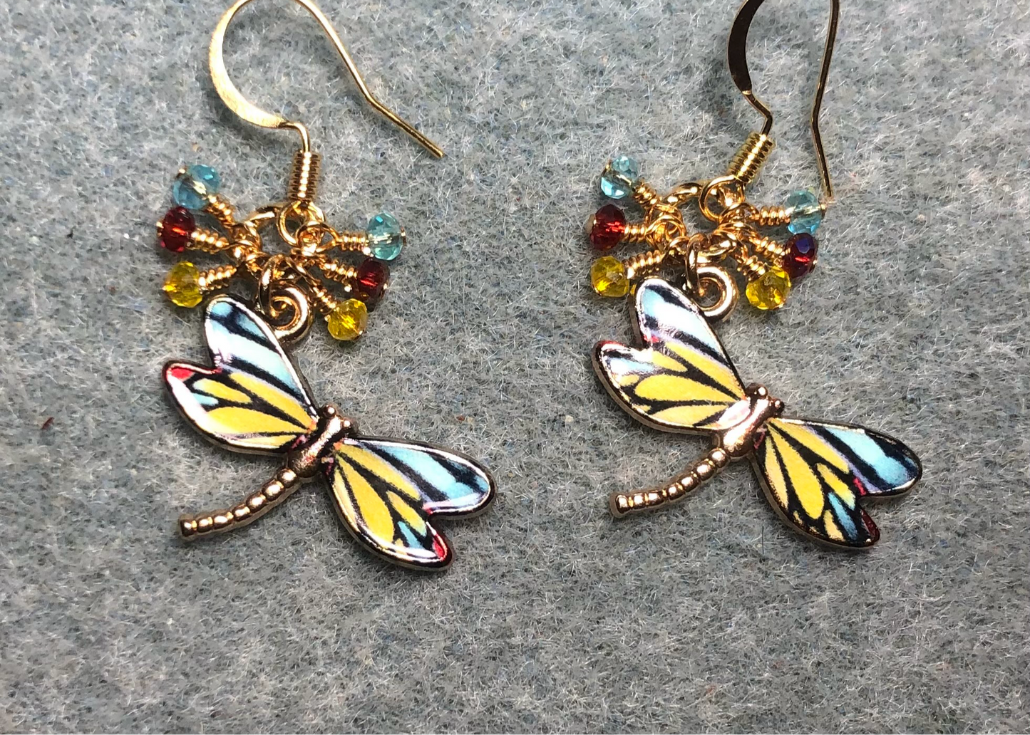 Yellow, turquoise, and red enamel dragonfly charm earrings adorned with tiny dangling yellow, turquoise, and red Chinese crystal beads.