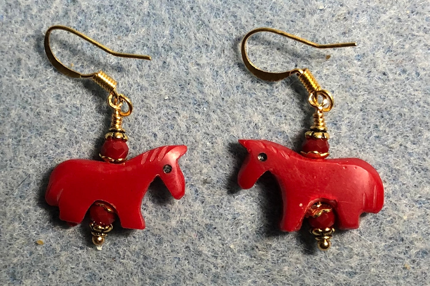 Bright red stone horse bead earrings adorned with dark red Chinese crystal beads.