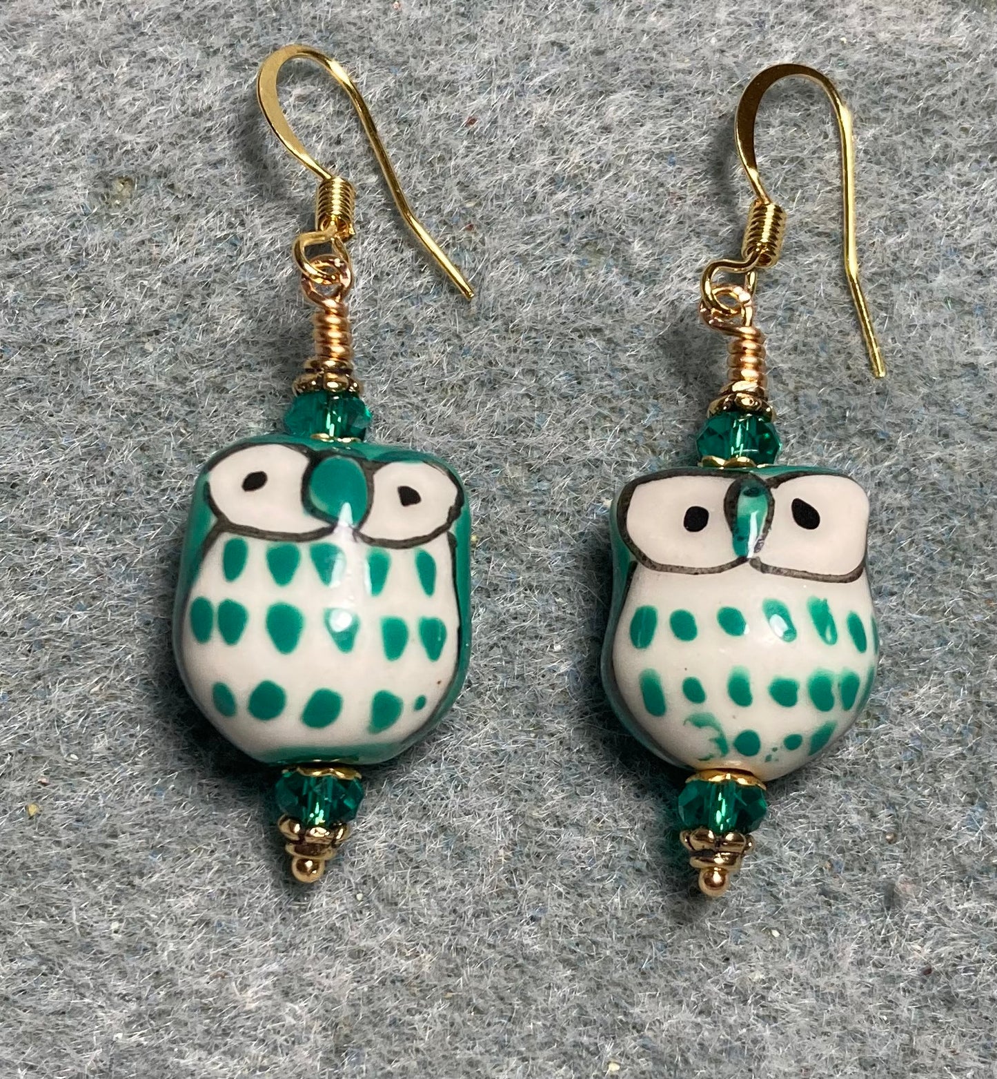 Teal ceramic spotted owl bead earrings adorned with teal Chinese crystal beads.