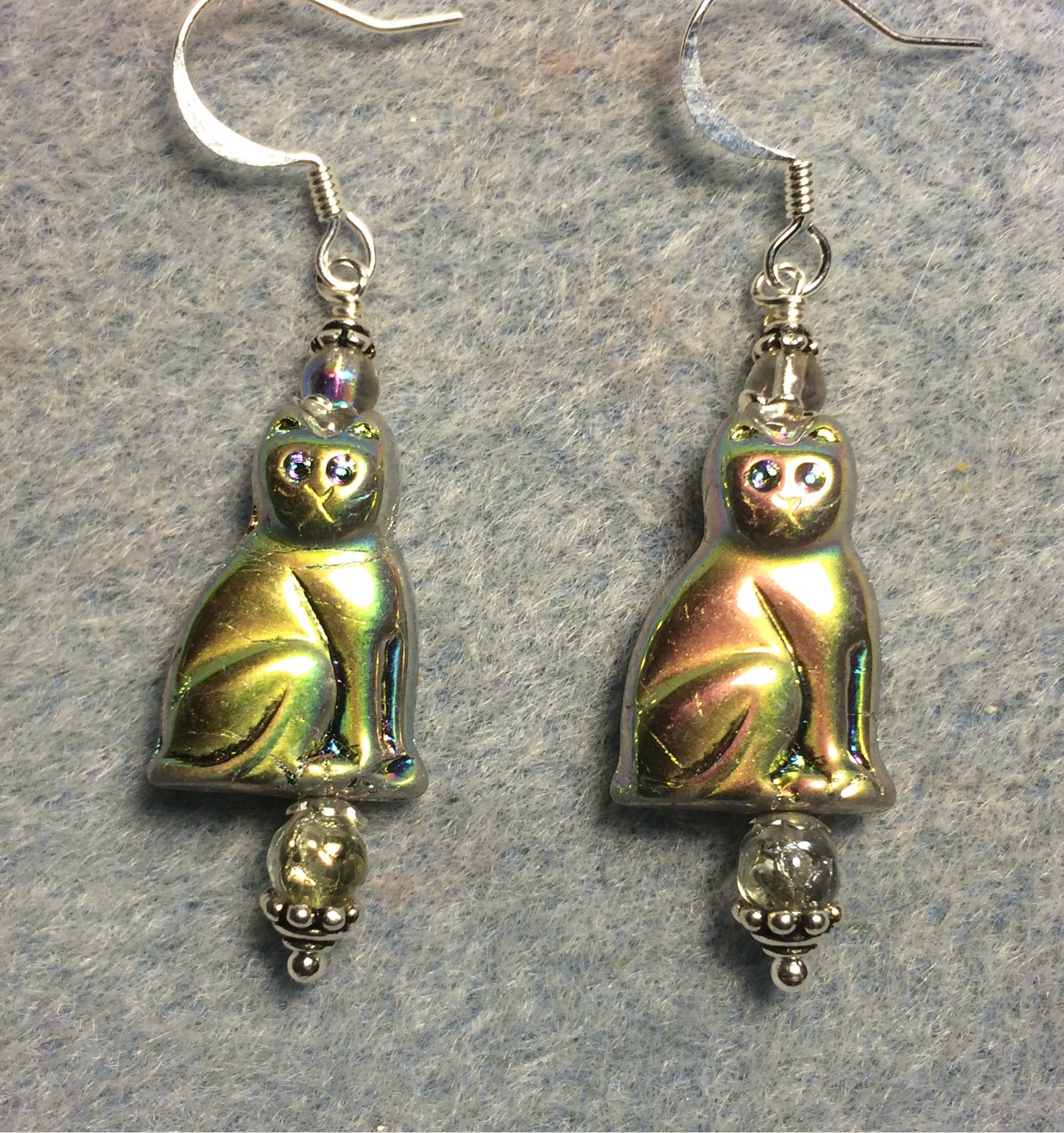 Metallic silver gold Czech glass cat bead earrings adorned with clear Czech glass beads.