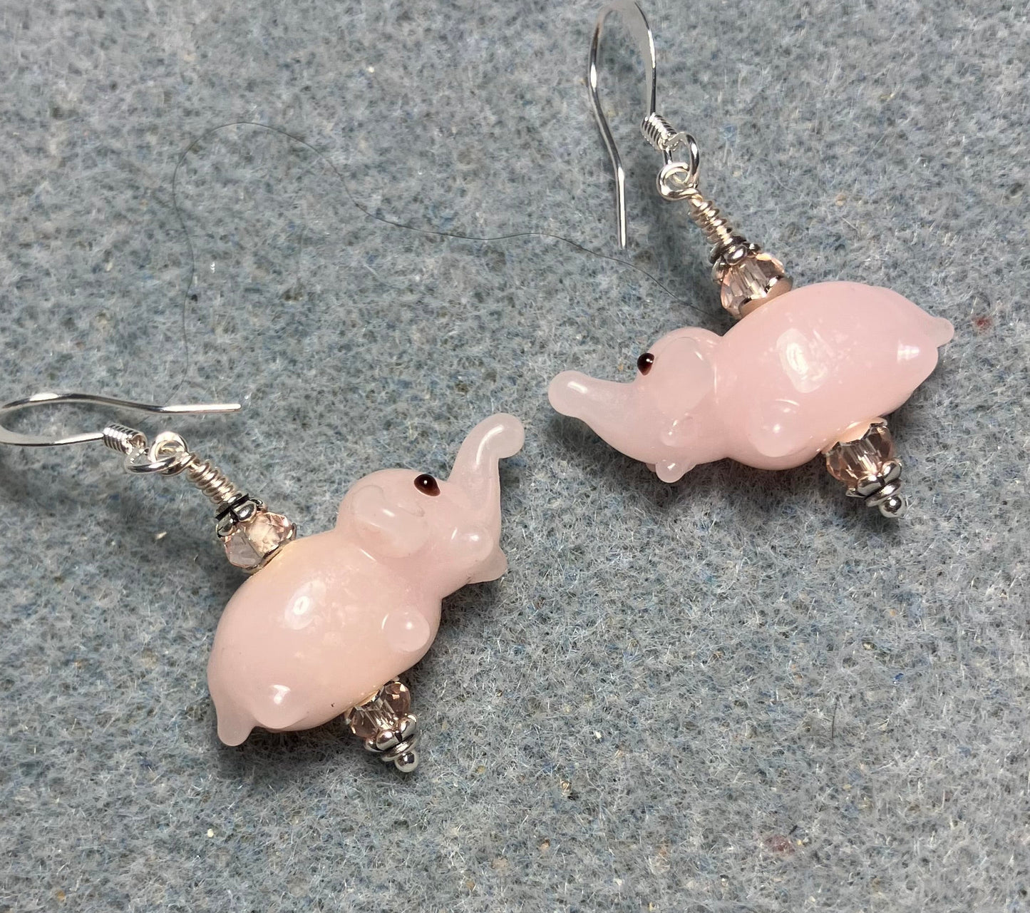 Small pink lamp work elephant bead earrings adorned with pink Chinese crystal beads.