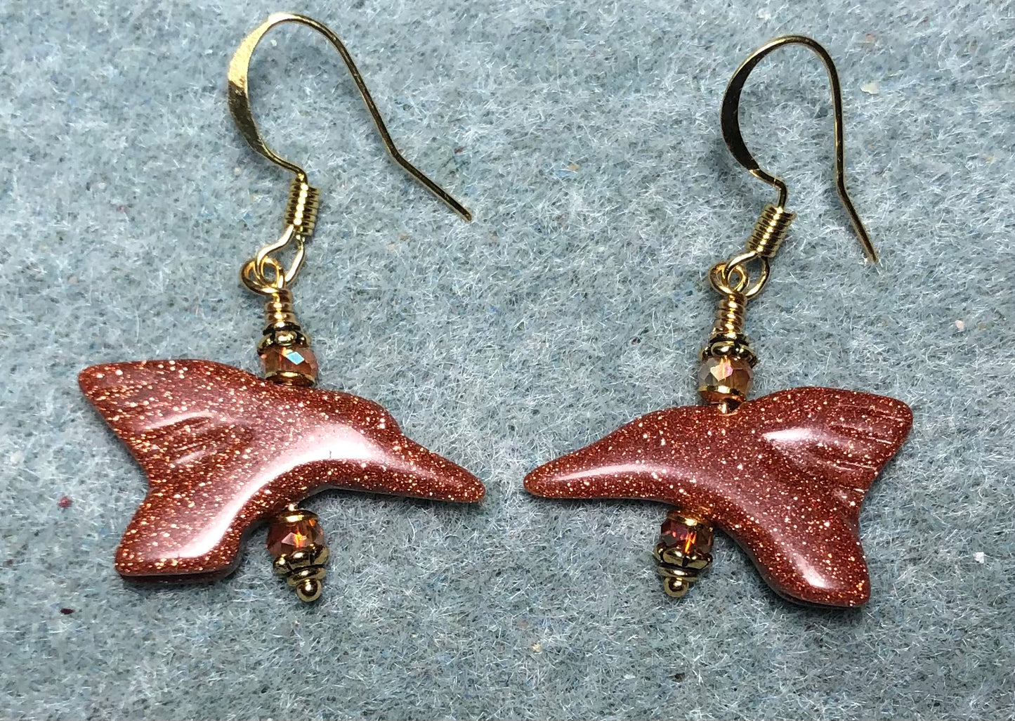 Orange goldstone gemstone hummingbird bead earrings adorned with orange Chinese crystal beads.