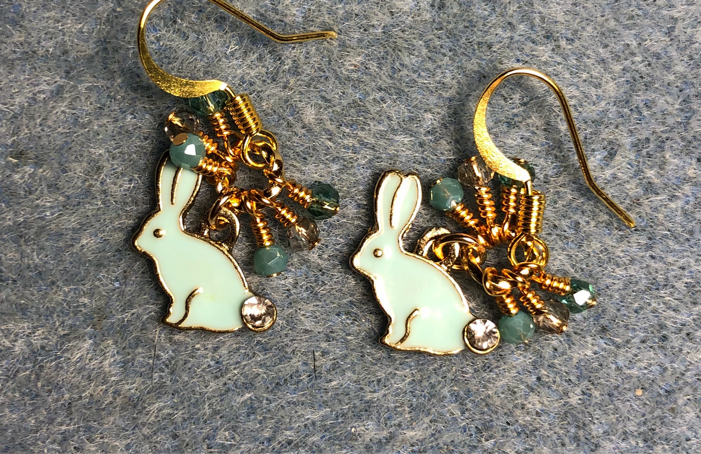 Small turquoise enamel and rhinestone rabbit charm earrings adorned with turquoise and clear Chinese crystal beads.