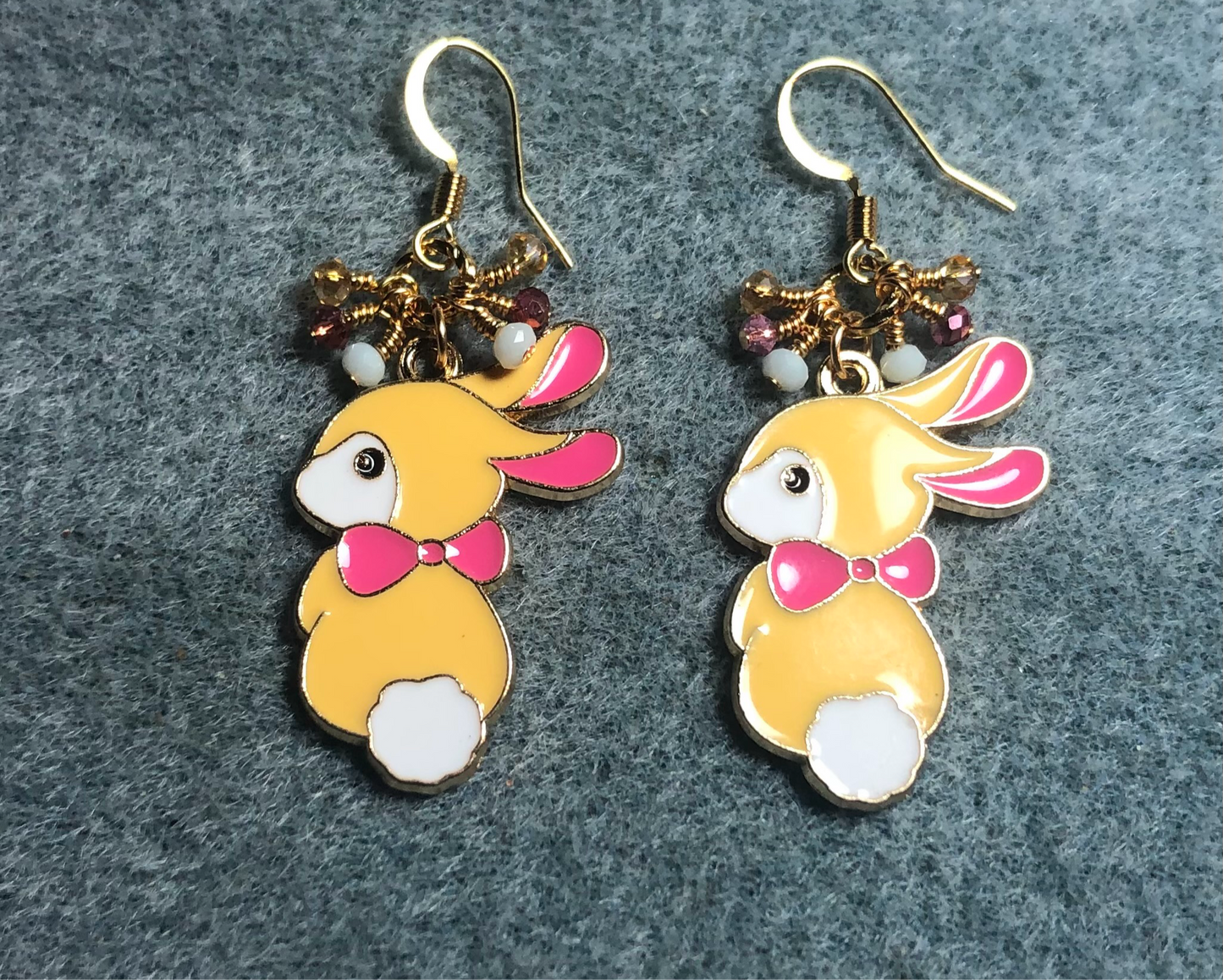 Amber, pink, and white enamel rabbit charm earrings adorned with amber, pink, and white Chinese crystal beads.